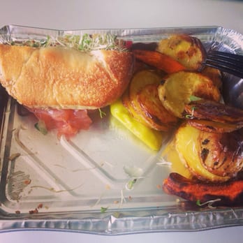 Korean style flank steak sandwich with sprouts and roasted potatoes