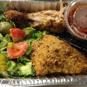 Crispy breaded fish and pulled pork plate with salad and dipping sauce